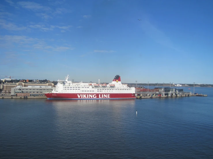 a large passenger ship floating on top of a river