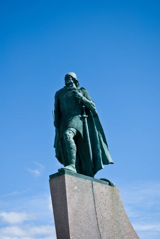 a large statue in front of the sky