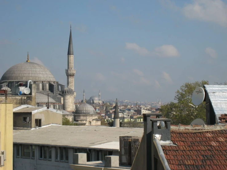 an overview of a very large building with a steeple in the background