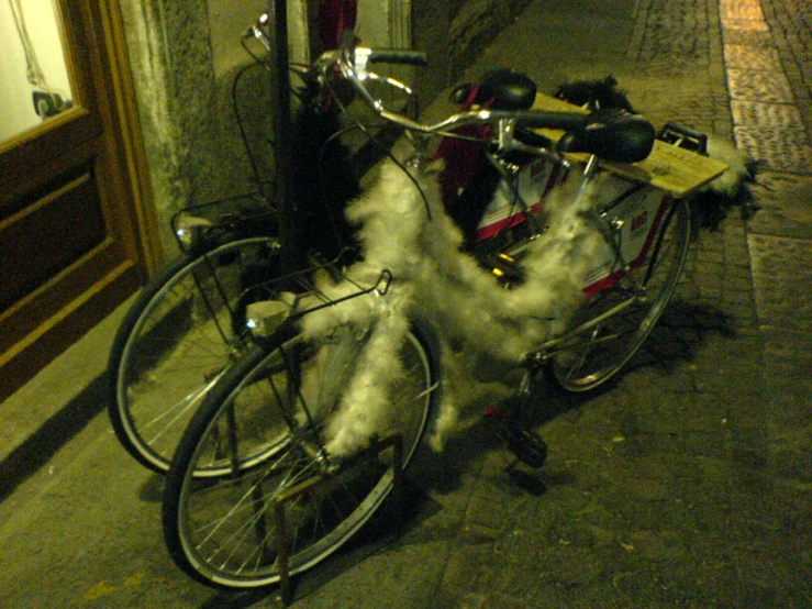 a bike has white smoke and sits on the side of a street