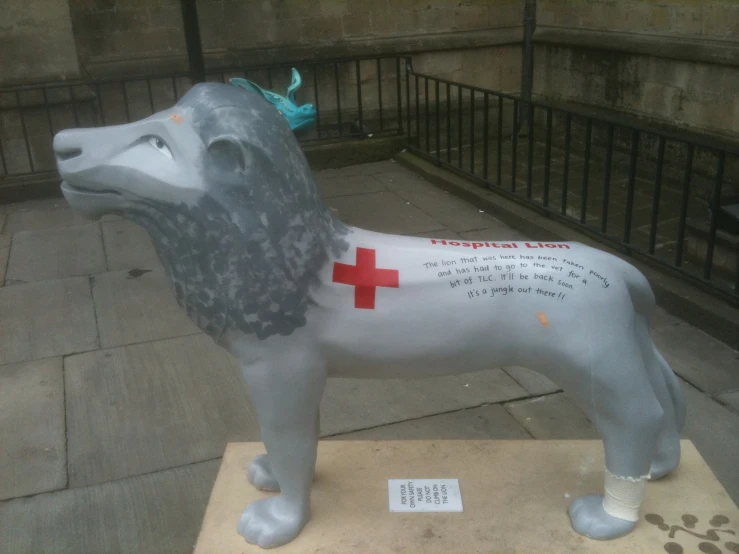 a dog statue with medical symbols on it