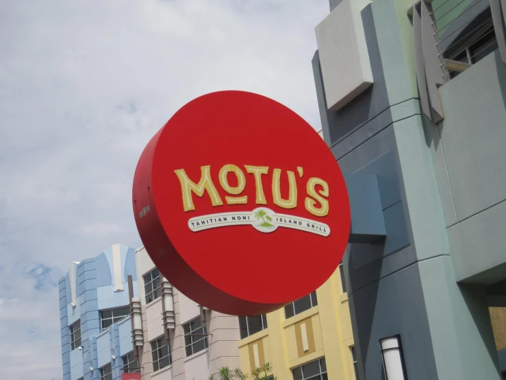 the sign on the outside of a building advertising motu's