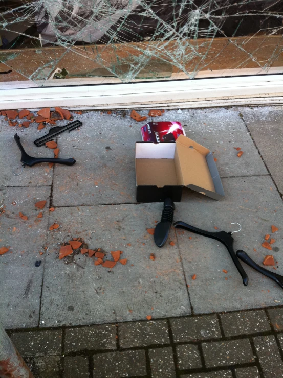 two black handled tools lay near a cardboard box