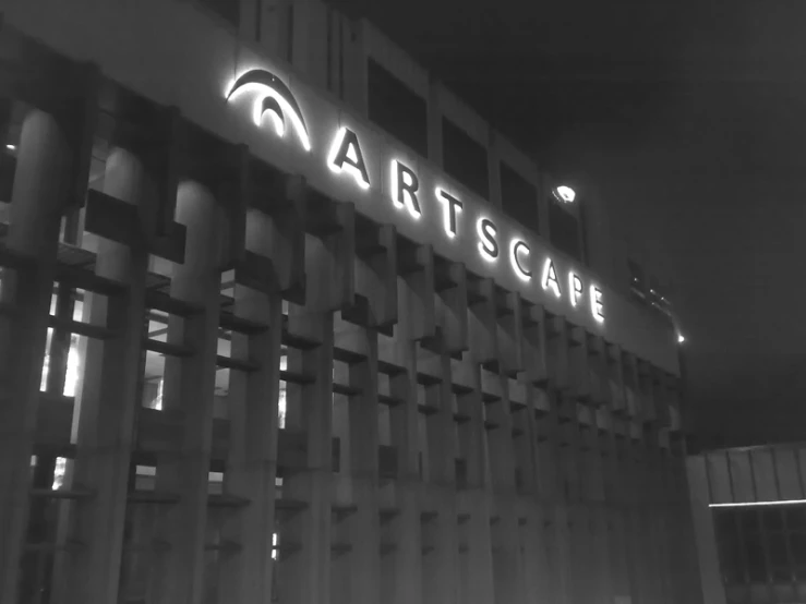 a black and white image of art scape in the dark