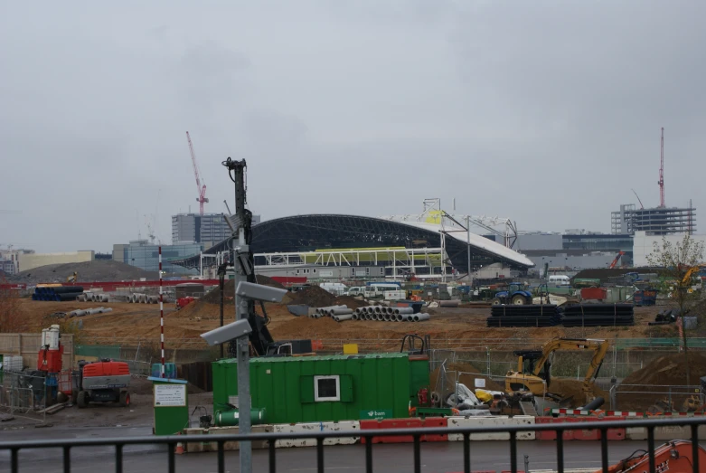 construction equipment is stacked in front of the building site