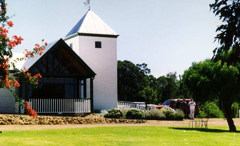 a white church in the middle of the park