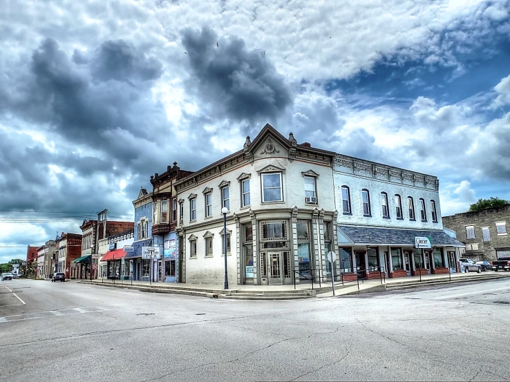 an old street in a town is empty and cloudy