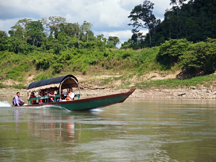 a group of people that are sitting on a boat