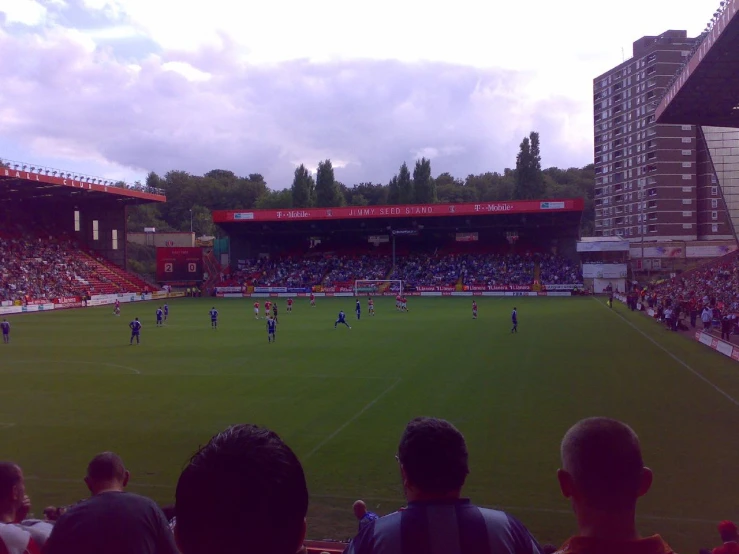 the field has many people watching a soccer game