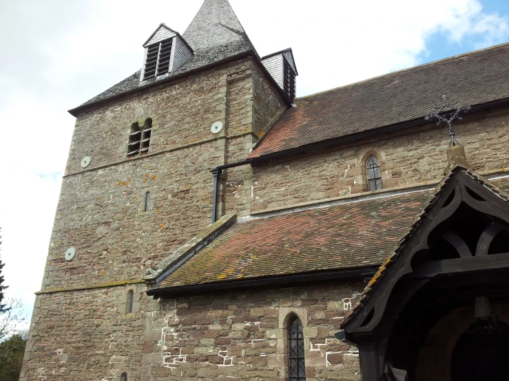 an old building with a large tower with a clock