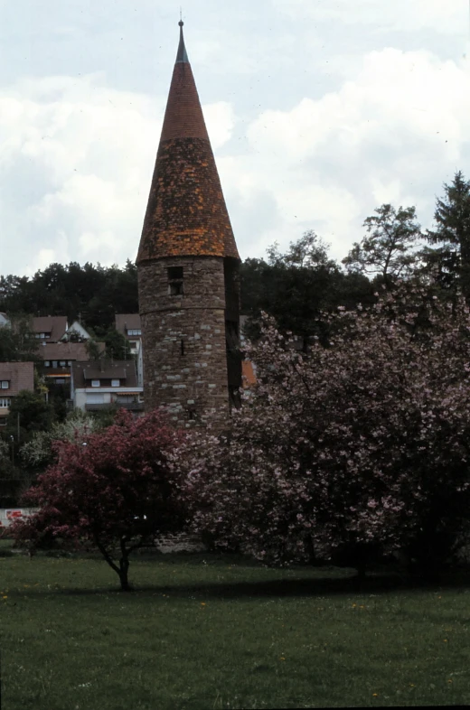 a building on a hill with a large clock tower