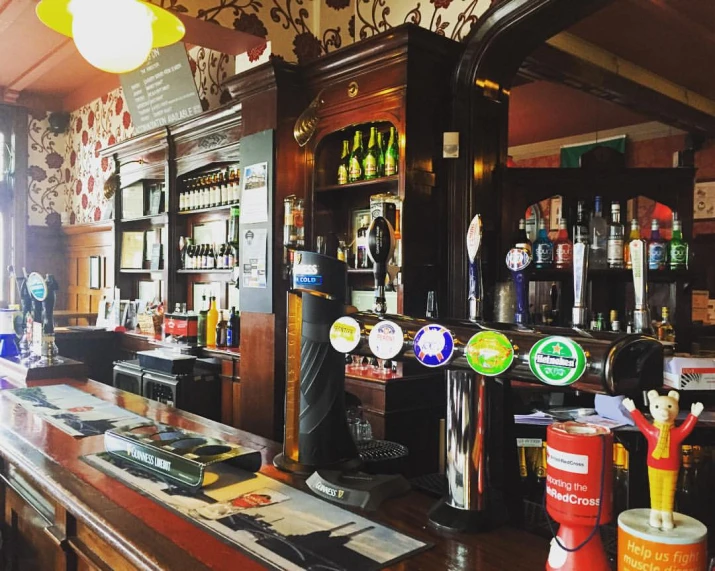 a large wooden bar with many different kinds of bottles