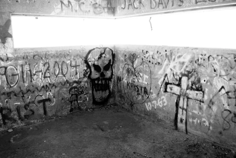 black and white pograph of a graffiti wall with grafitti