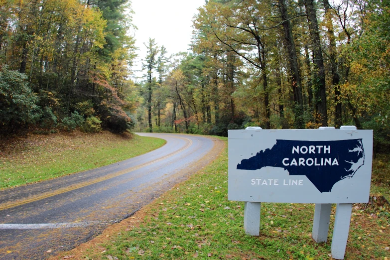 a small sign by the road warning to not visit north carolina