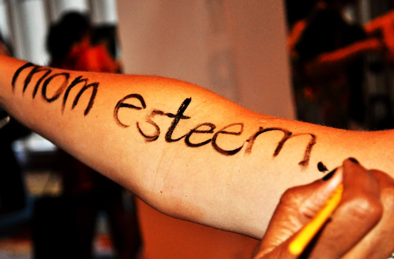 a person with a tattooed arm with writing written on them