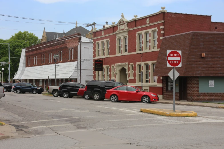 cars are parked in the front parking lot of this building