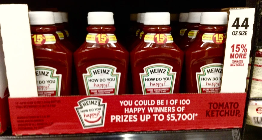 a display of ketchup drinks and a card saying, you could be happy winners of prizes up to $ 5, 100