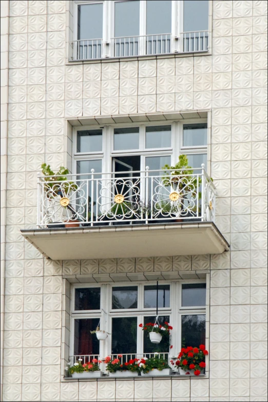 balcony balconies of an apartment building decorated with flower potted plants and ornamental ornaments