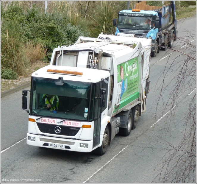 a tow truck that is driving down the road