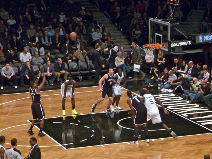 the ball flies past the basket of the other team during a game