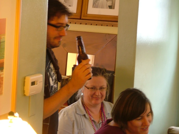 a man is blow drying a woman's hair