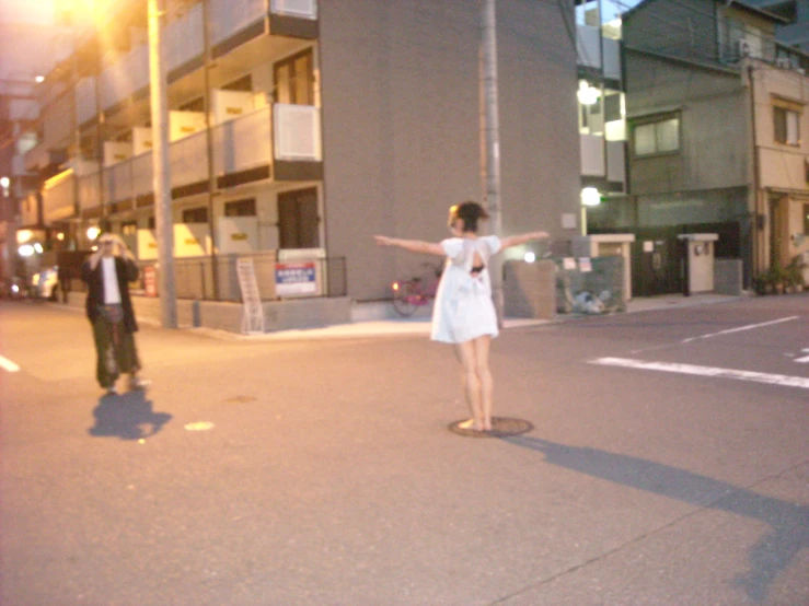 a woman on a skateboard in the street