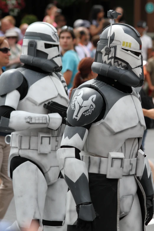 two men in star wars costumes standing near each other