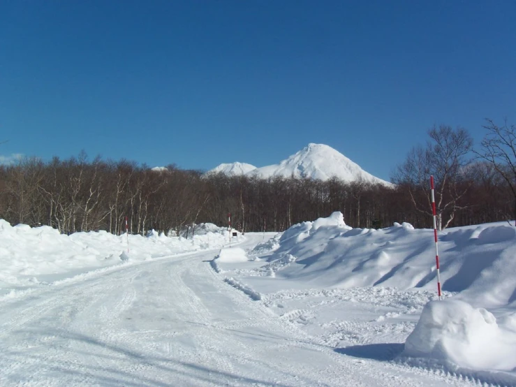 an over - hill ski run with a view of a mountain