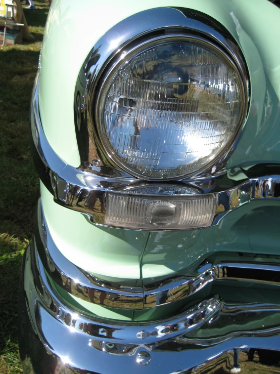 a po of the rear end of a car showing chrome paint and mirrors