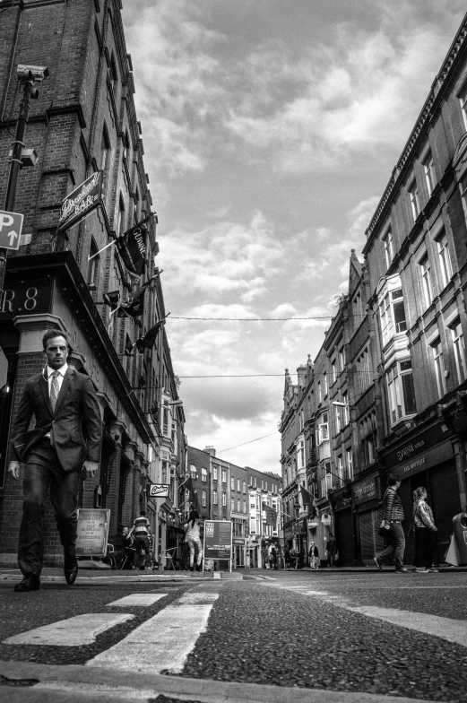 black and white po of two people in business suits walking down the street