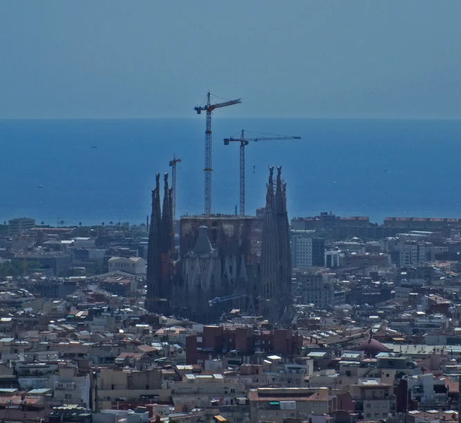 a city filled with lots of tall buildings under construction