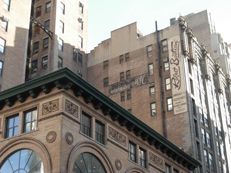 a very tall brick building with a clock