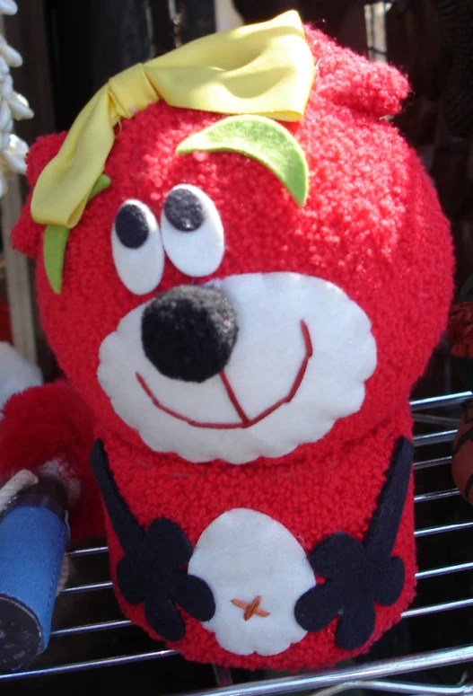 a stuffed animal with a bow around its neck