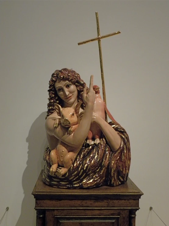 the statue is displayed with a cross on it