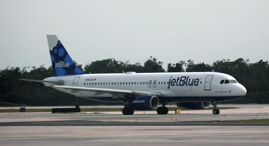 a jetblue airplane parked on the runway