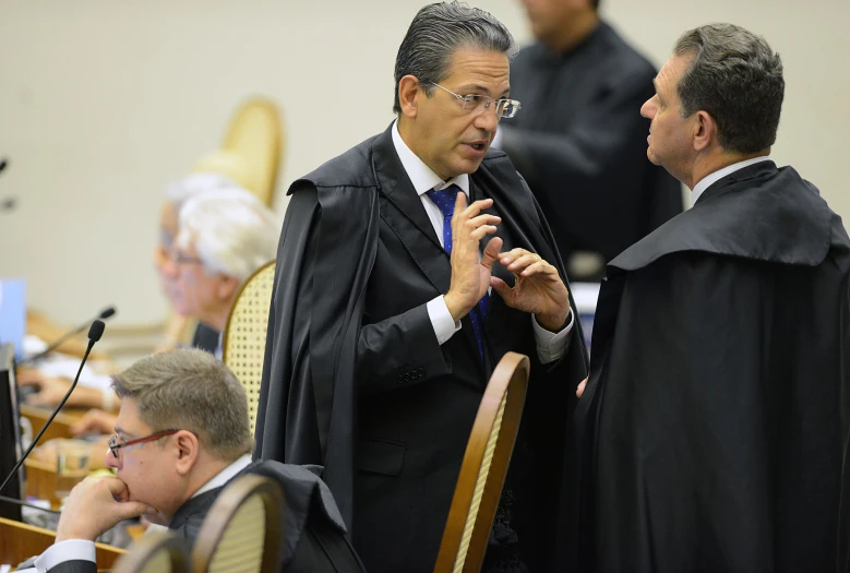 a judge being held up with a microphone