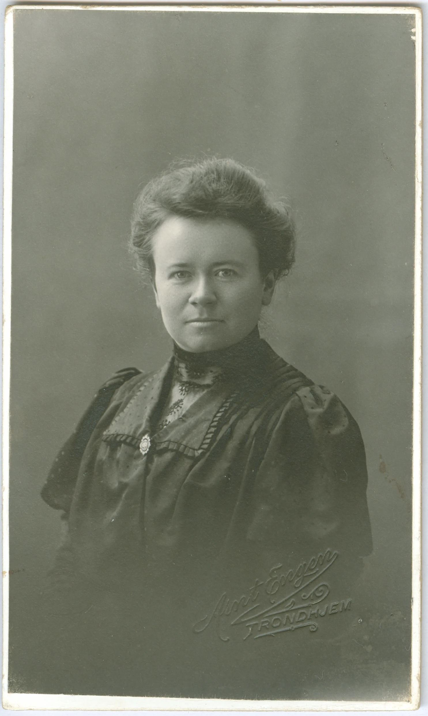 a lady in a black and white po posing for the camera