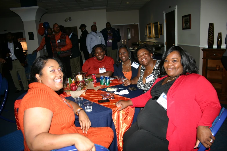 a group of women seated around a dinner table