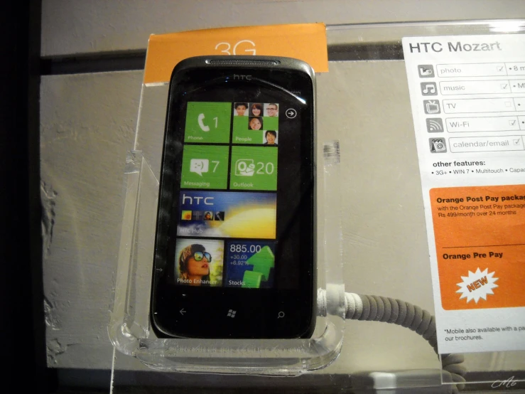 a mobile phone is shown with its box open