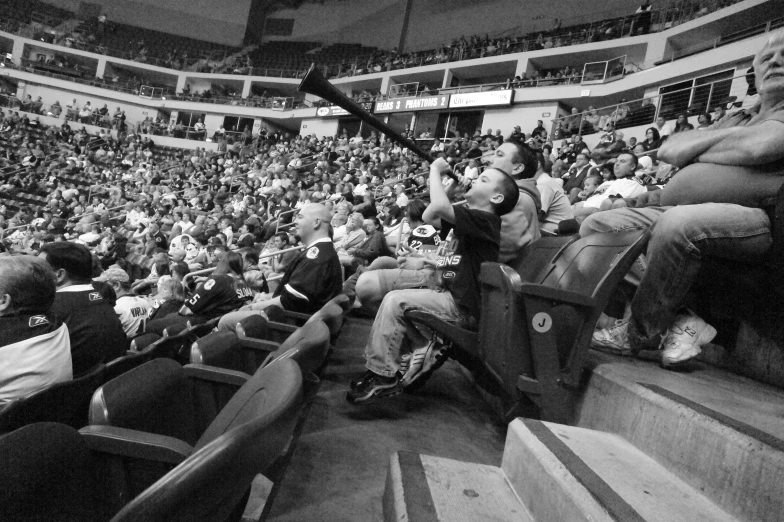 some people on the bleachers watching soing