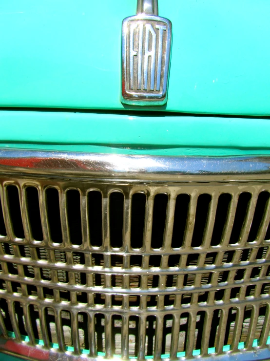 an old car grille is adorned with a emblem