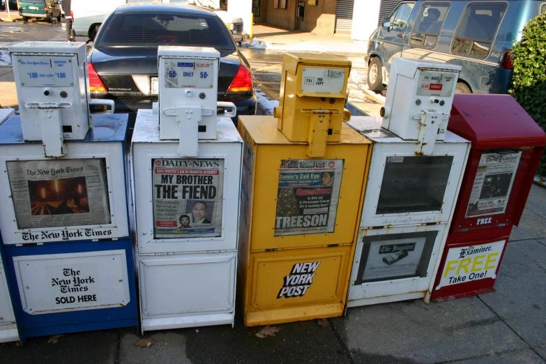 old advertit machines for sale lined up on the sidewalk