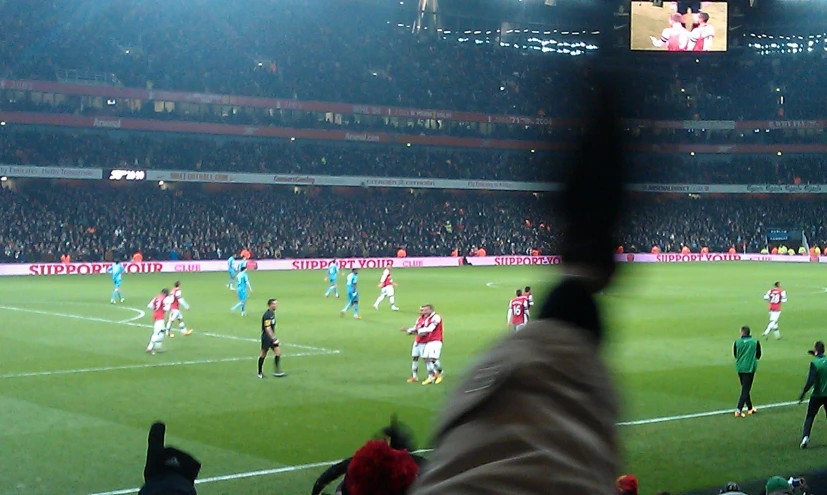 several soccer players are playing a game of soccer