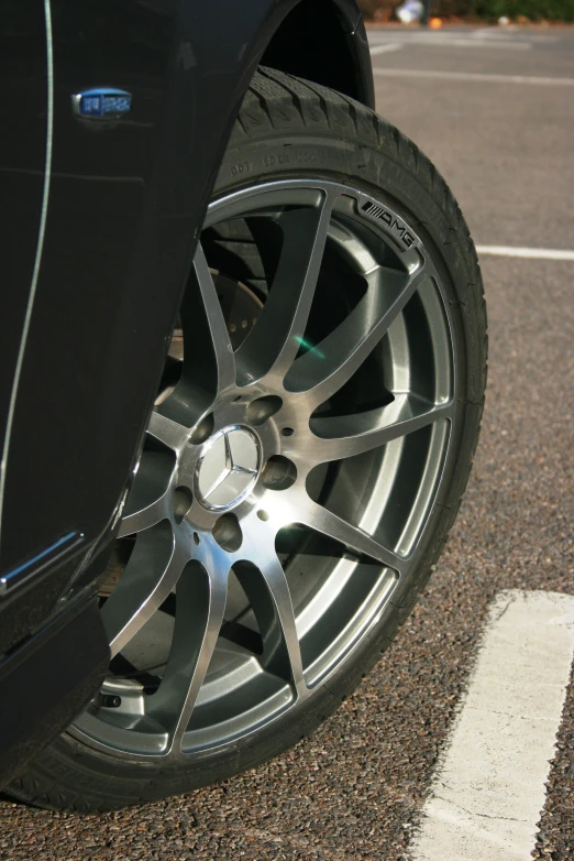 a car wheel that is parked on the road