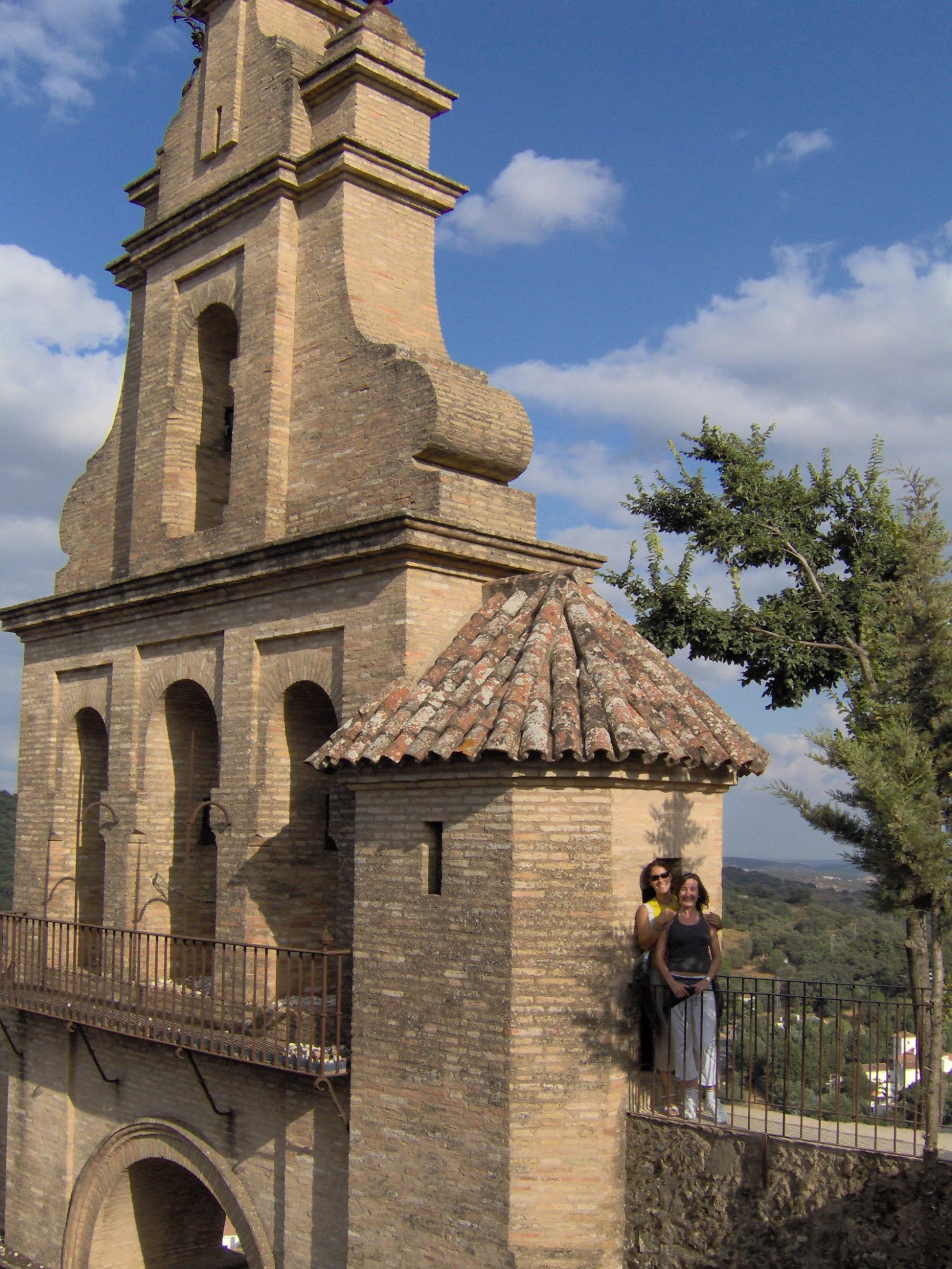 a couple is standing in front of an old building