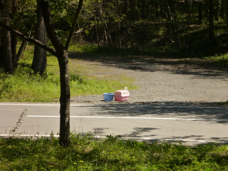 there are two cones sitting on the side of the road