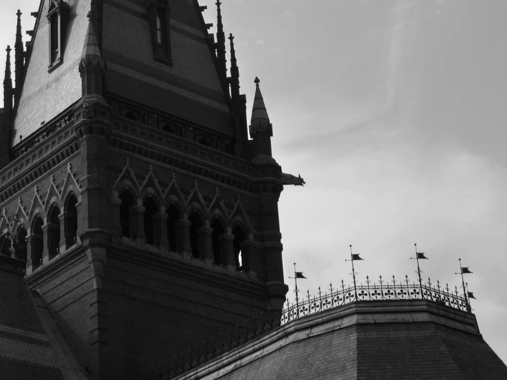 a clock tower sitting below the cloudy sky