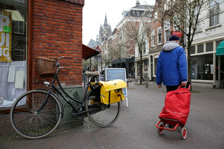 a bicycle that is pulling some sort of yellow bag