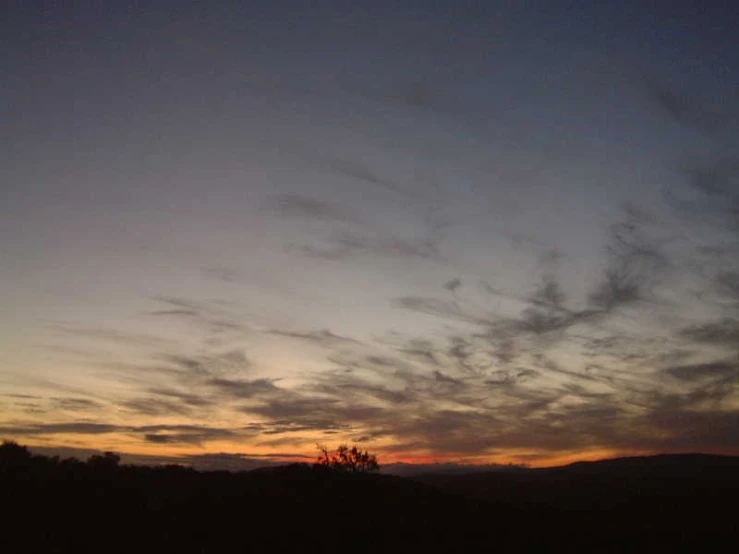 the sky has a couple clouds that are in it