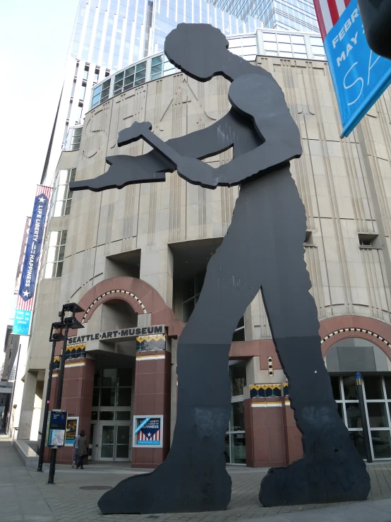 a large metal cut out of a man with a guitar